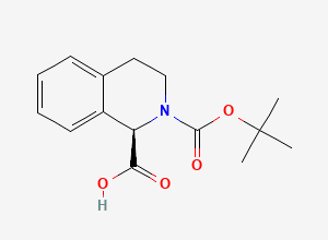 Two-dimensional chemical structure of (R)-2-(tert-butoxycarbonyl)-1,2,3,4-tetrahydroisoquinoline-1-carboxylic acid
