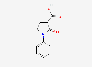 Two-dimensional chemical structure of 2-Oxo-1-phenylpyrrolidine-3-carboxylic acid