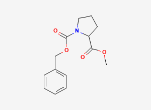 Two-dimensional chemical structure of 1-Benzyl 2-methyl pyrrolidine-1,2-dicarboxylate